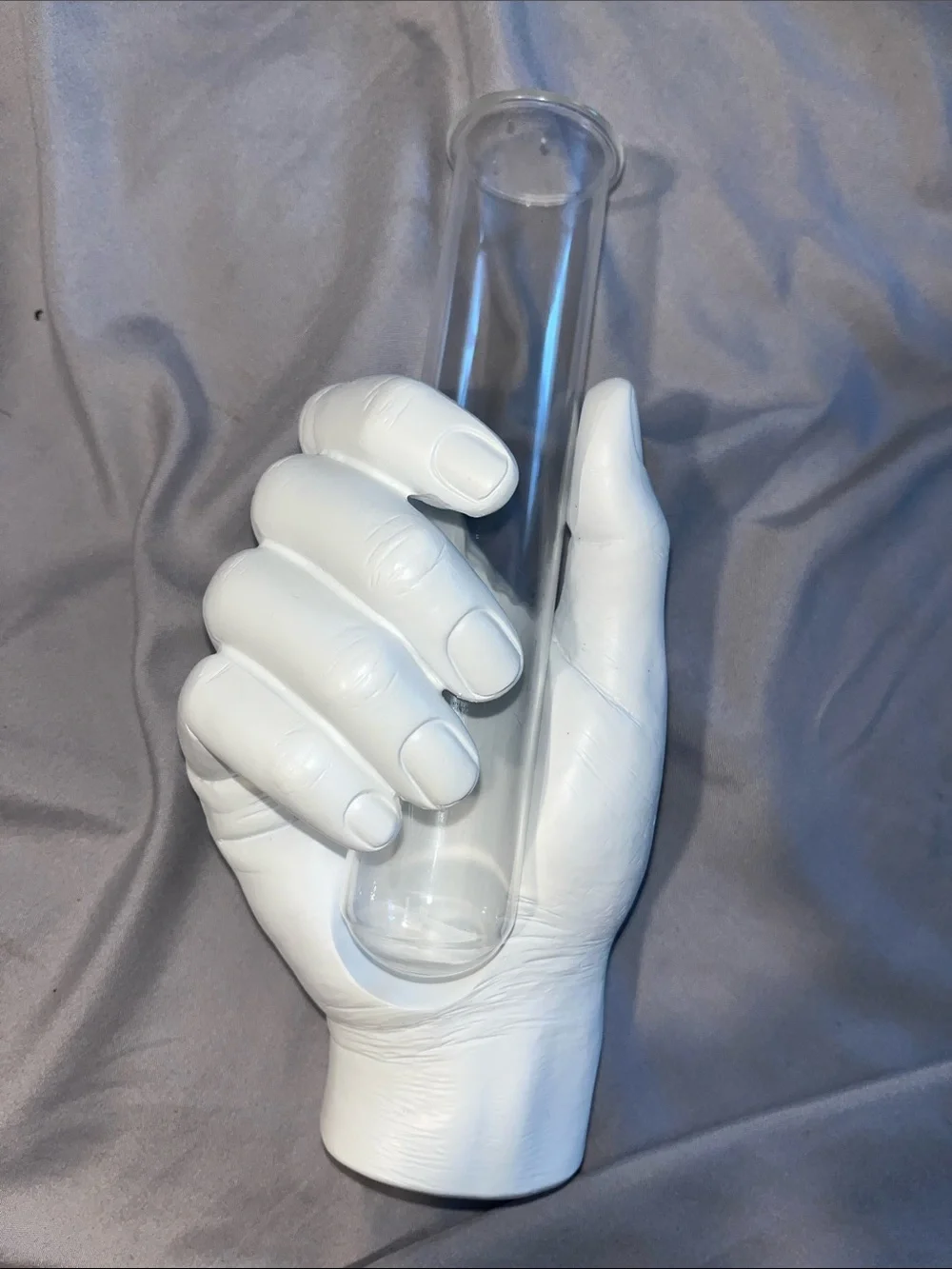 White Hand Vase Holding Clear Glass Tube